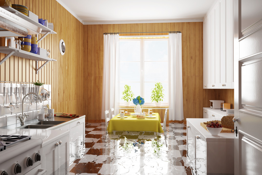 a kitchen with water on the floor