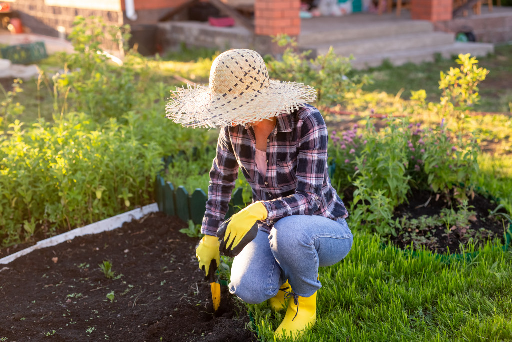 A woman gardening on her yard